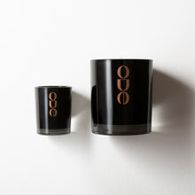 Load image into Gallery viewer, Large and mini soy candle on white background. Black gloss finished glass jars with bronze Ode logo
